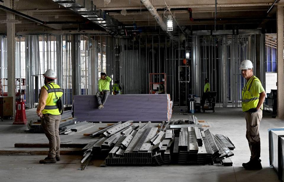 Construction workers paused as House Speaker Mike Johnson, R-LA, toured the construction site for the $100 million ground-level passenger terminal at Sarasota Bradenton International Airport.