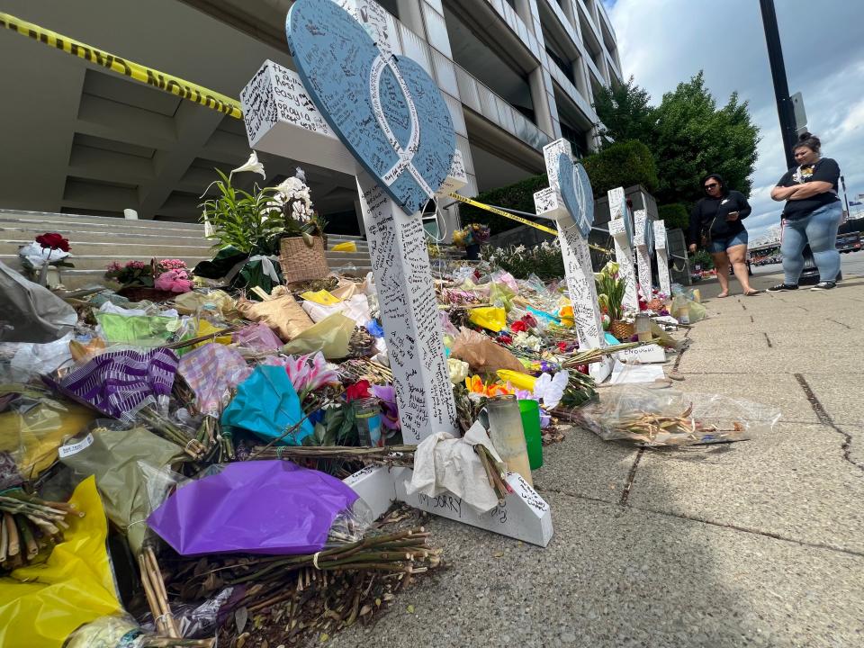 Walking past the steps of the Old National Bank in downtown Louisville,  people grew silent to pay respects to the victims who died. People came to downtown to attend the Thunder Over Louisville events on Saturday, April 22, 2023.