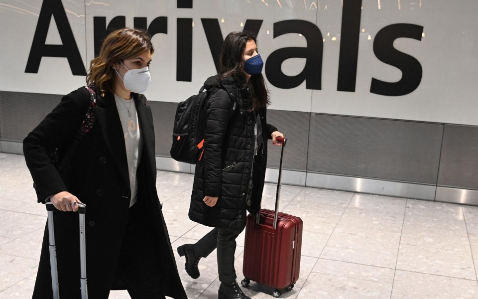 Travelers in the international arrival area of Heathrow Airport near London, Britain, 15 January 2021 - Shutterstock/NEIL HALL