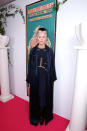 <p>Daphne Guinness, always one to stand out from a crowd, wore a navy blue dress with floor-length silk trench coat and sky-high platform boots. Her multi-hued hair was styled á la inside out Cruella De Vil circa 2015.</p>