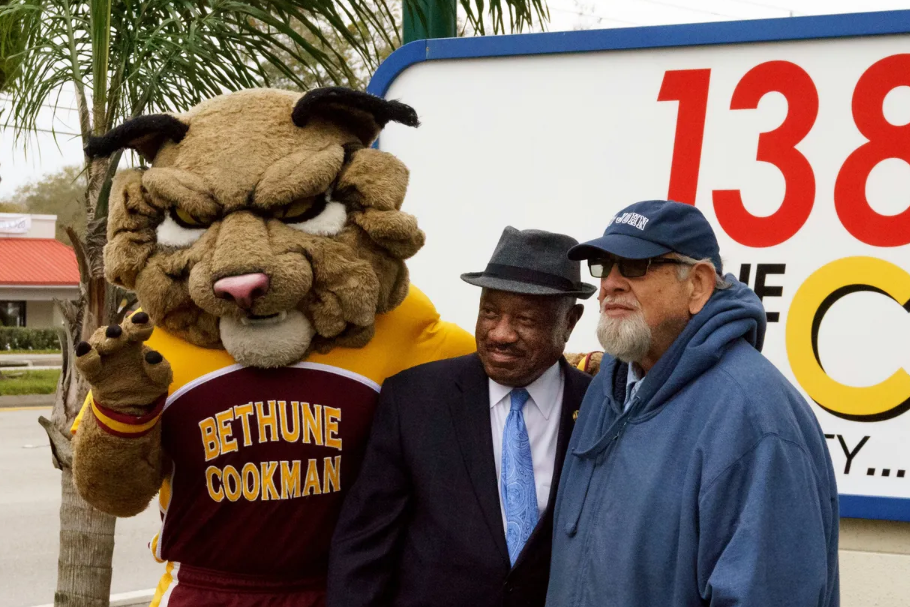 Bethune-Cookman mascot Wil D Cat poses with the late radio host Big John (right) and then-B-CU President Edison Jackson in 2013.