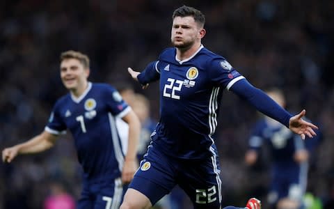 Oliver Burke's late goal gave Clarke a winning start as Scotland manager - Credit: REUTERS