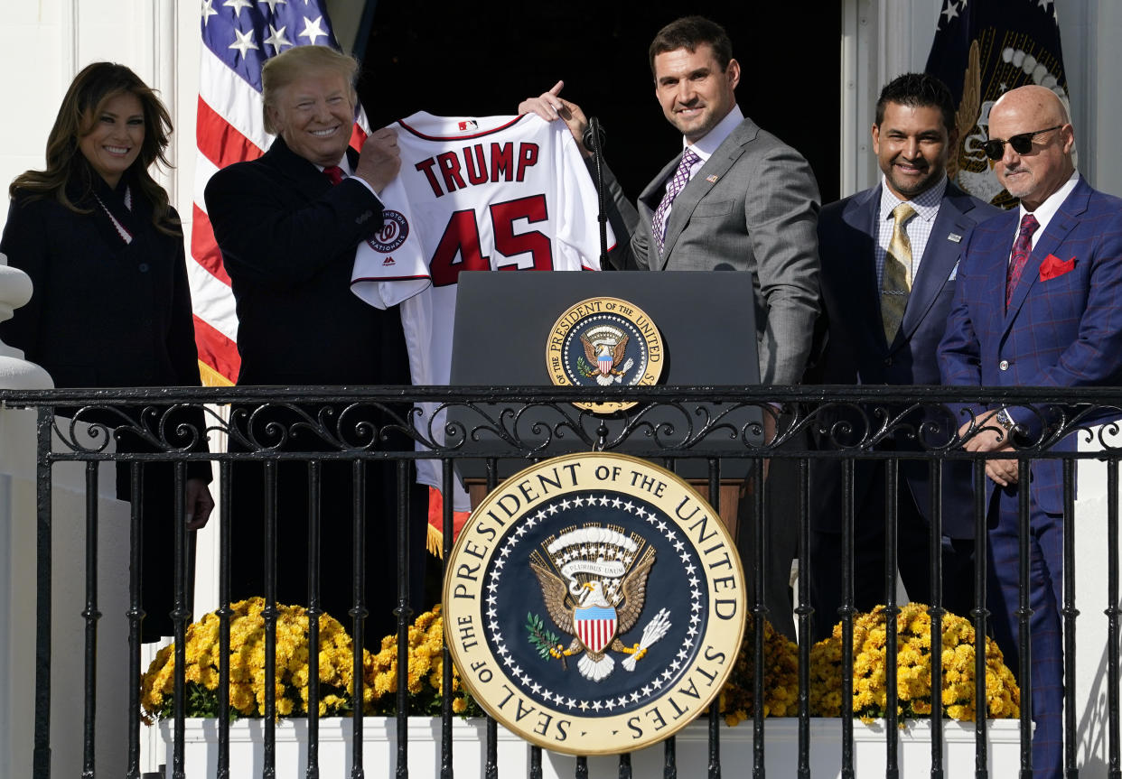 President Trump holds up a jersey from the Washington Nationals. (Getty)