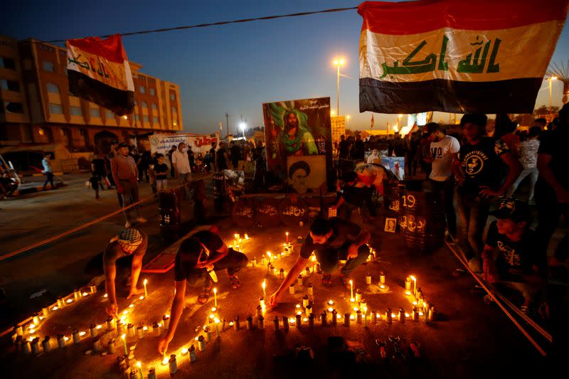 Iraqis march in Najaf on the anniversary of the anti-government protests