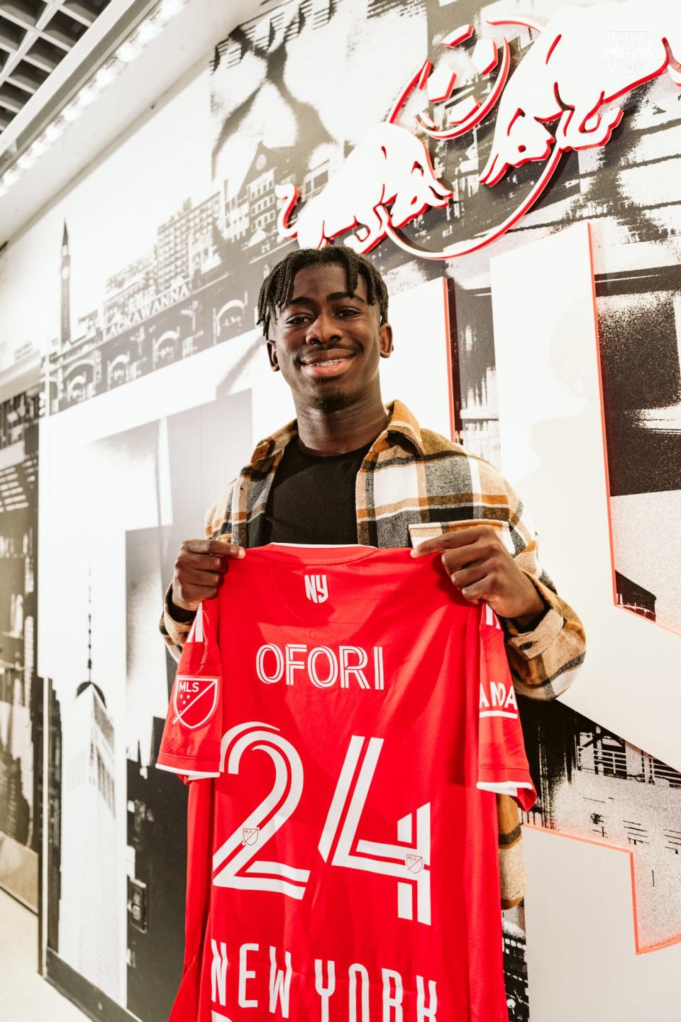 Curtis Ofori, a 17-year-old from Wappingers Falls, poses with his New York Red Bull jersey after signing a "homegrown" contract with the club in December 2022.