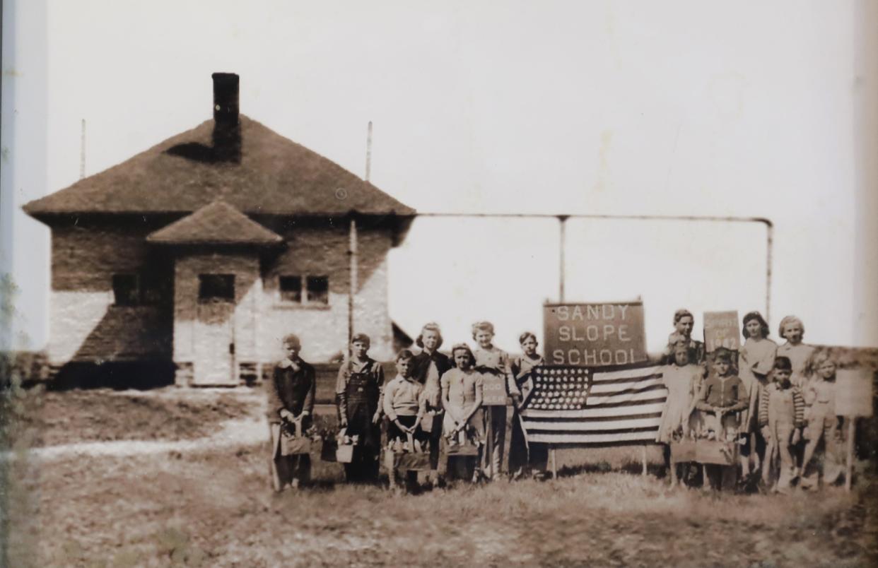 A photo of a historic photo of the former Sandy Slope School with students standing out front taken Monday, July 10, 2023, in Appleton, Wis. Dan Powers/USA TODAY NETWORK-Wisconsin.