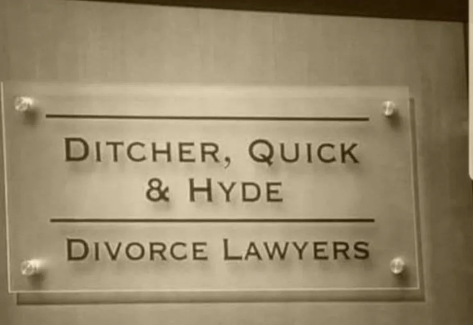 Sign on a wall reading "Ditcher, Quick & Hyde Divorce Lawyers."