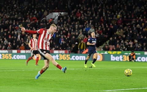 Oliver McBurnie of Sheffield United scores his sides first goal during the Premier League match between Sheffield United and West Ham United - Credit: GETTY IMAGES