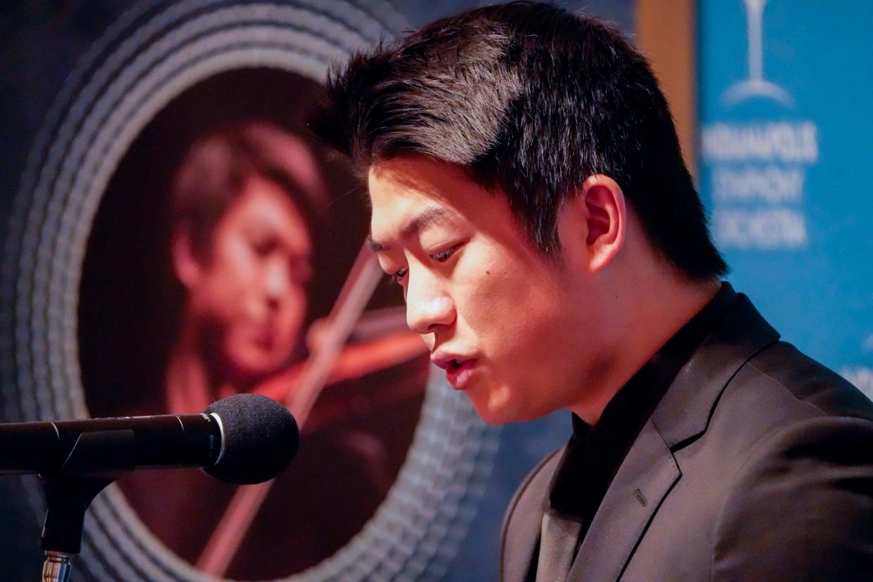 Kevin Lin, ISO Concertmaster for the Indianapolis Symphony Orchestra (ISO) announces Jun Märkl as its new music director during a press conference at the on Tuesday, January 23, 2024, in Indianapolis.