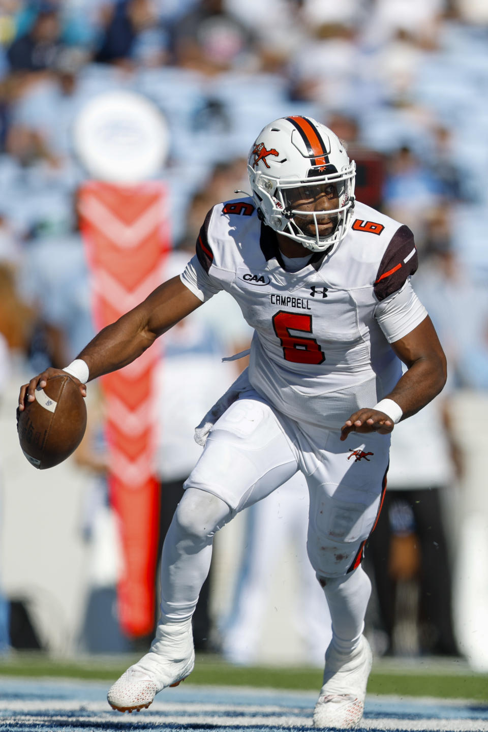 Campbell quarterback Hajj-Malik Williams (6) scrambles for a first down against North Carolina in the second half of an NCAA college football game in Chapel Hill, N.C., Saturday, Nov. 4, 2023. North Carolina won 59-7. (AP Photo/Nell Redmond)