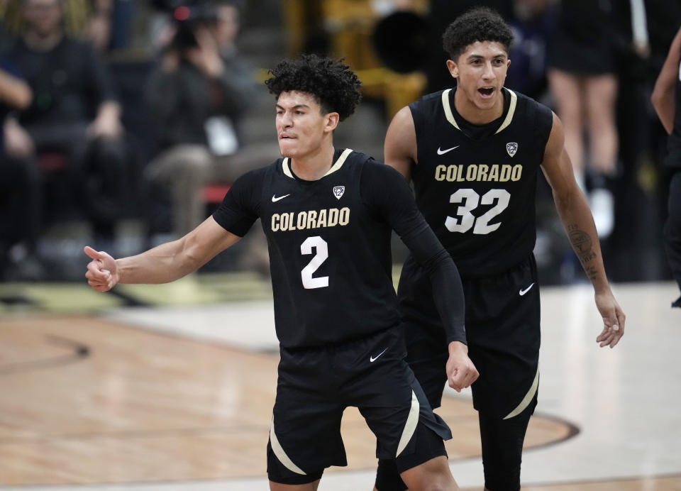 Colorado guard KJ Simpson, left, reacts after hitting a 3-point basket as guard Nique Clifford looks on in the second half of an NCAA college basketball game against Colorado State, Thursday, Dec. 8, 2022, in Boulder, Colo. (AP Photo/David Zalubowski)