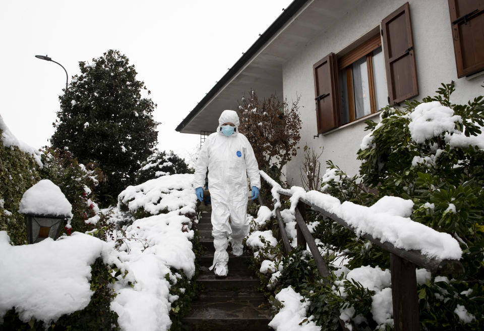 Doctor Luigi Cavanna leaves a COVID-19 patient's home in Monticelli d'Ongina, near Piacenza, Italy, Wednesday, Dec. 2, 2020. (AP Photo/Antonio Calanni)