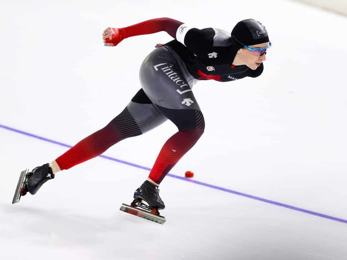 Canada's Ivanie Blondin, shown in this file photo in the final of World Cup speedskating in 2020, won the women's mass start at the Canadian long track speed skating championships on Sunday in Calgary. (Peter Dejong/The Associated Press - image credit)