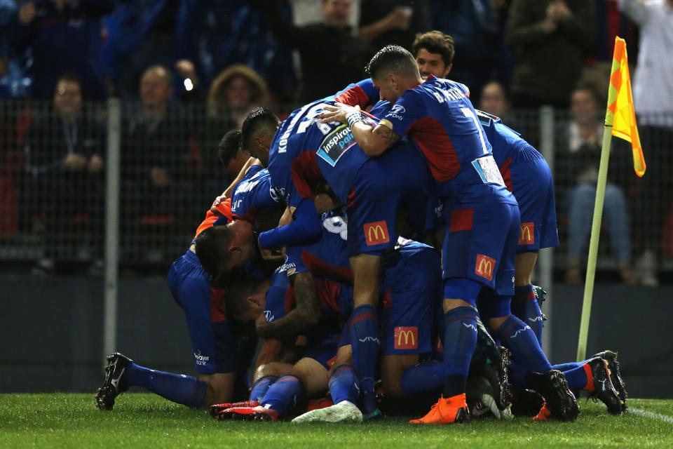 Newcastle Jets players celebrate Riley McGree’s scorpion kick goal in their A-League semifinal against Melbourne City. (Getty)