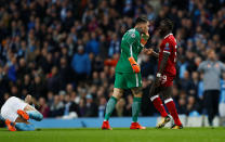 <p>Soccer Football – Champions League Quarter Final Second Leg – Manchester City vs Liverpool – Etihad Stadium, Manchester, Britain – April 10, 2018 Manchester City’s Ederson clashes with Liverpool’s Sadio Mane after a challenge on Manchester City’s Nicolas Otamendi Action Images via Reuters/Jason Cairnduff </p>