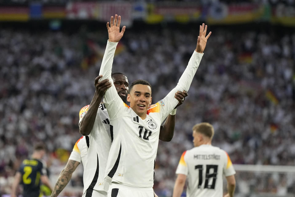 Germany's Jamal Musiala celebrates after scoring his side's second goal during a Group A match between Germany and Scotland at the Euro 2024 soccer tournament in Munich, Germany, Friday, June 14, 2024. (AP Photo/Matthias Schrader)