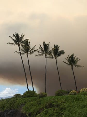 Smoke blankets the sky as a wildfire spreads in Maui