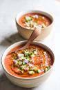 <p>Plum tomatoes, cucumbers, and red onion come together with white vinegar, garlic, and olive oil to make this super easy and delicious summer soup. Garnish with green onions, a swirl of olive oil, and plenty of freshly ground black pepper for a restaurant-level presentation.</p><p>Get the <strong><a href="https://www.delish.com/cooking/recipe-ideas/a27794655/easy-gazpacho-soup-recipe/" rel="nofollow noopener" target="_blank" data-ylk="slk:Gazpacho recipe" class="link ">Gazpacho recipe</a>.</strong></p>