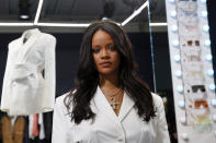 Rihanna poses as she unveils her first fashion designs for Fenty at a pop-up store in Paris, France, Wednesday, May 22, 2019. Singer Rihanna is the first black woman in history to head up a major Parisian luxury house, and the collection, named after the singer turned designer's last name, comprises of ready-to-wear, footwear, accessories, and eyewear and is available for sale Paris' Le Marais area from Friday and will debut online May 29. (AP Photo/Francois Mori)