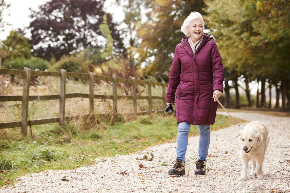 Woman walking her dog. (Getty Images)