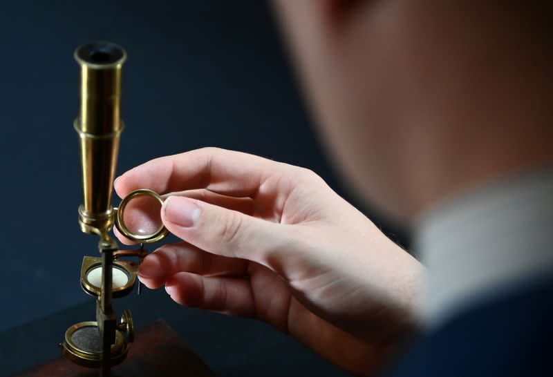 Darwin Family Microscope, owned and used by the English naturalist, Charles Darwin, demonstrated ahead of auction at Christie's, London