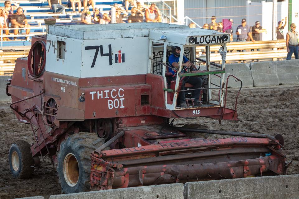 A large combine is lined up and ready to go during the demolition derby at the Monroe County Fair grandstand.