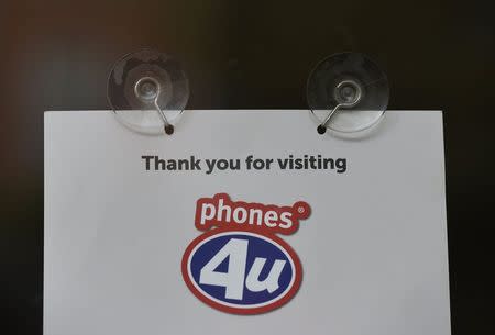 The detail of a printed message is seen on a branch of Phones 4u in west London, September 15, 2014. REUTERS/Toby Melville