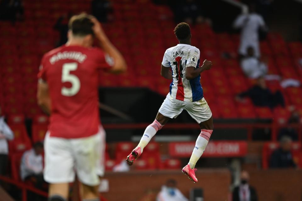 Crystal Palace's Wilfried Zaha (right) scored two goals in a win over Manchester United at Old Trafford. (Photo by SHAUN BOTTERILL/POOL/AFP via Getty Images)