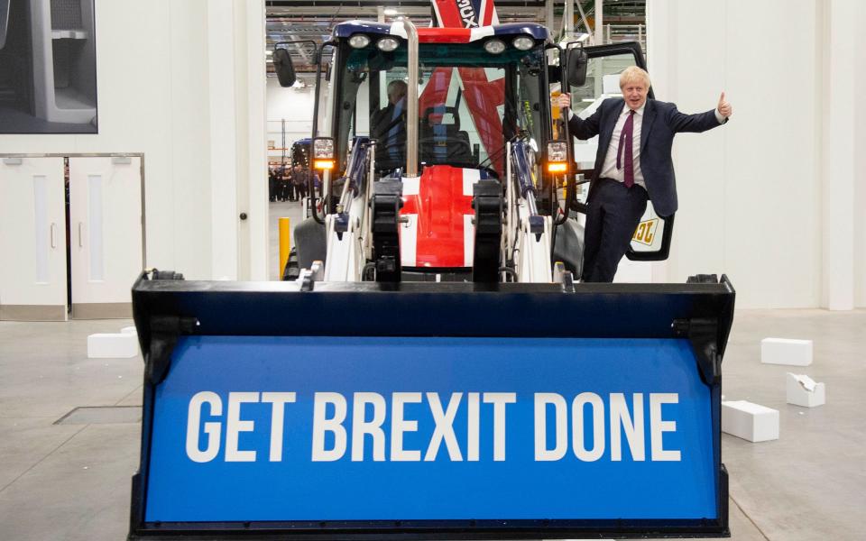 Boris Johnson drives home his message at the JCB factory last year - Julian Simmonds