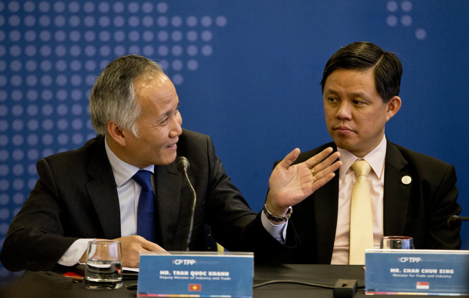 Tran Quoc Khanh, Vietnam's Deputy Minister of Industry and Trade, left, speaks next to Singapore's Industry and Trade Minister Chan Chun Sing, during a meeting of the Comprehensive and Progressive Agreement for Trans-Pacific Partnership, CP TPP, in Santiago, Chile, Thursday, May 16, 2019. (AP Photo/Esteban Felix)