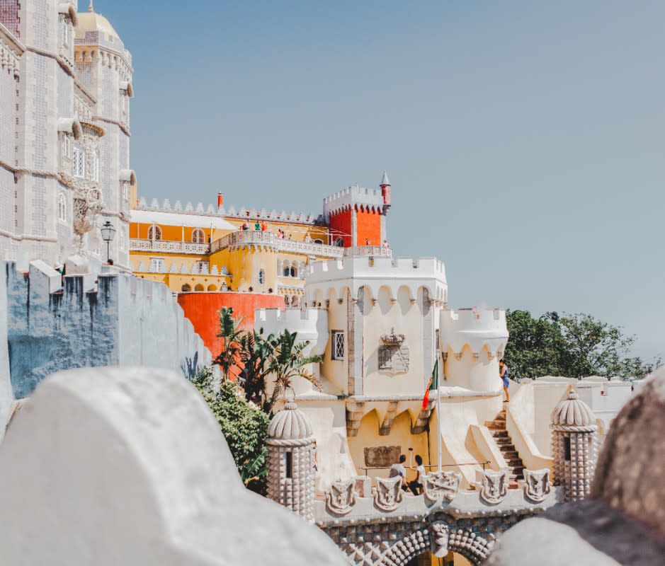 Sintra's UNESCO-tapped wonders are headlined by Pena Palace, a mashup of medieval architecture towering over the city on a woodsy hilltop.<p>Getty Images</p>