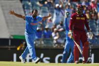India's bowler Mohammed Shami (L) appeals unsuccessfully for the wicket of West Indies batsman Chris Gayle (R) during their Cricket World Cup match in Perth, March 6, 2015. REUTERS/David Gray