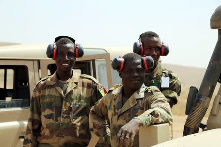 Senegalese soldiers watch a car bomb explosion during the U.S.-led "Flintlock" training exercises for African militaries, in Thies, Senegal February 18, 2016. REUTERS/Emma Farge