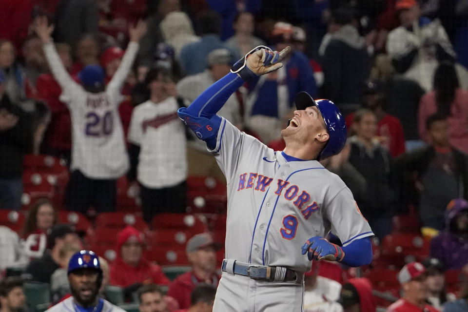 New York Mets' Brandon Nimmo celebrates as he arrives home after hitting a two-run home run during the ninth inning of a baseball game against the St. Louis Cardinals Monday, April 25, 2022, in St. Louis. (AP Photo/Jeff Roberson)