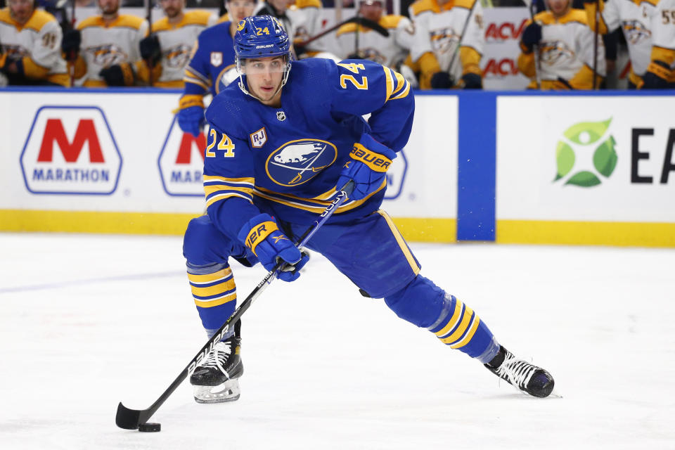 Buffalo Sabres center Dylan Cozens (24) controls the puck during the first period of an NHL hockey game against the Nashville Predators, Friday, April 1, 2022, in Buffalo, N.Y. (AP Photo/Jeffrey T. Barnes)