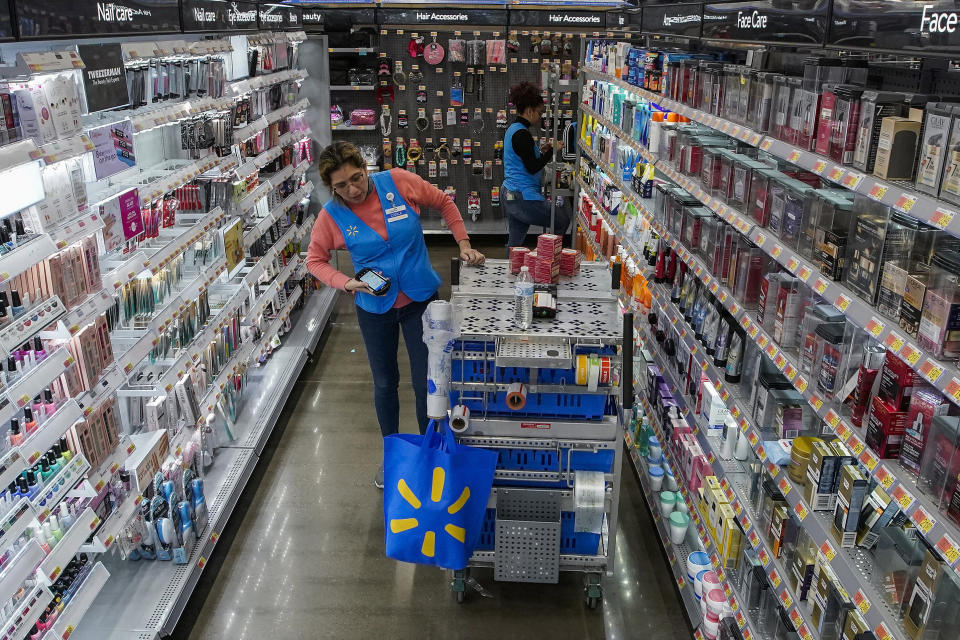 File - An employee organizes beauty products inside the Walmart Supercenter in North Bergen, N.J. on Thursday, Feb. 9, 2023. Companies from toothpaste makers to even discounters are adding more premium items like designer body creams as they reach out to wealthier shoppers. Walmart features high-end $90 creams in its beauty aisles at select stores. (AP Photo/Eduardo Munoz Alvarez, File)