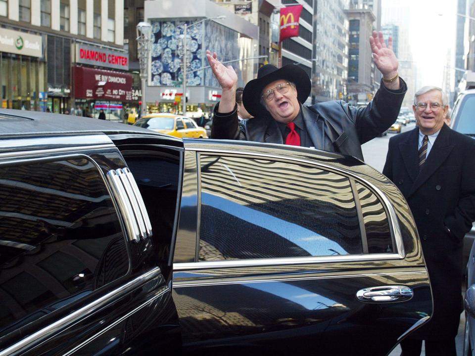 Andrew Jackson aka Jack Whittaker waves as he gets into his rented limousine at Sixth Ave. and 48th St. during a visit to New York City after winning the $314.9 million Powerball jackpot on Christmas day in 2002.