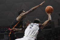 Grambling State's Prince Moss, left, fouls Connecticut's R.J. Cole in the first half of an NCAA college basketball game, Saturday, Dec. 4, 2021, in Storrs, Conn. (AP Photo/Jessica Hill)