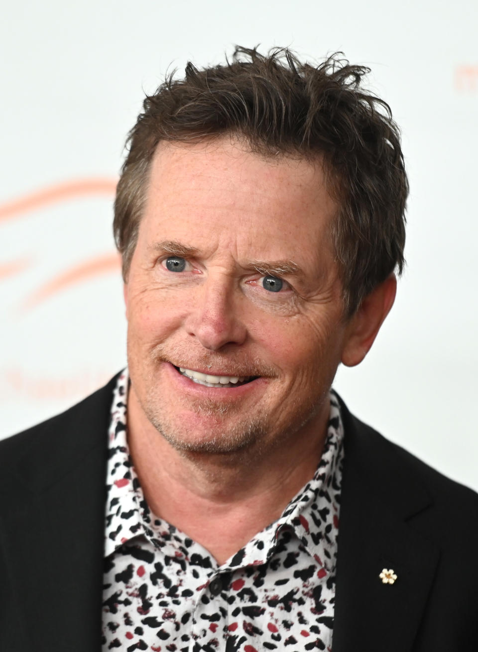 Michael J. Fox poses at the A Funny Thing Happened On The Way To Cure Parkinson's event on October 23, 2021