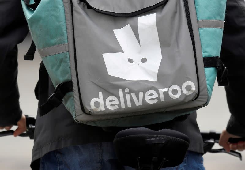 FILE PHOTO: A Deliveroo delivery rider cycles in London, Britain