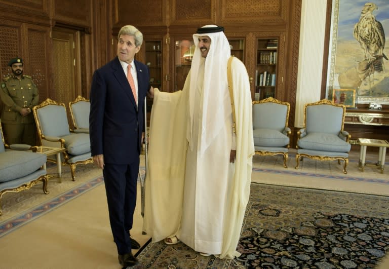 US Secretary of State John Kerry (left) talks with Qatar's Emir Sheikh Tamim bin Hamad al-Thani before their meeting at the Diwan Palace in Doha, on August 3, 2015