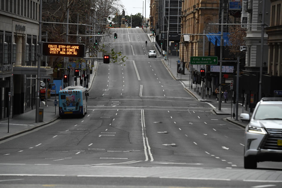 An empty Bridge St is seen in the central business district in Sydneyy, Wednesday, July 21, 2021. The stay-at-home orders for coronavirus-hit Greater Sydney and surrounds have been tightened with non-essential retail to close and all construction paused until July 30.