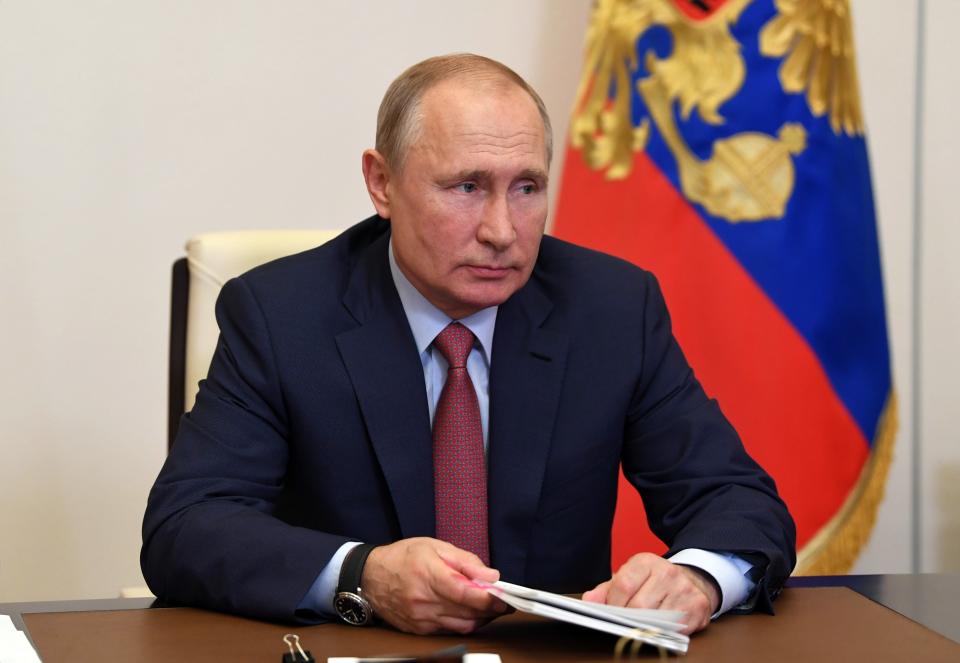 Russian President Vladimir Putin attends a meeting on education via teleconference at the Novo-Ogaryovo residence outside Moscow, Russia, Thursday, May 21, 2020. (Alexei Nikolsky, Sputnik, Kremlin Pool Photo via AP)