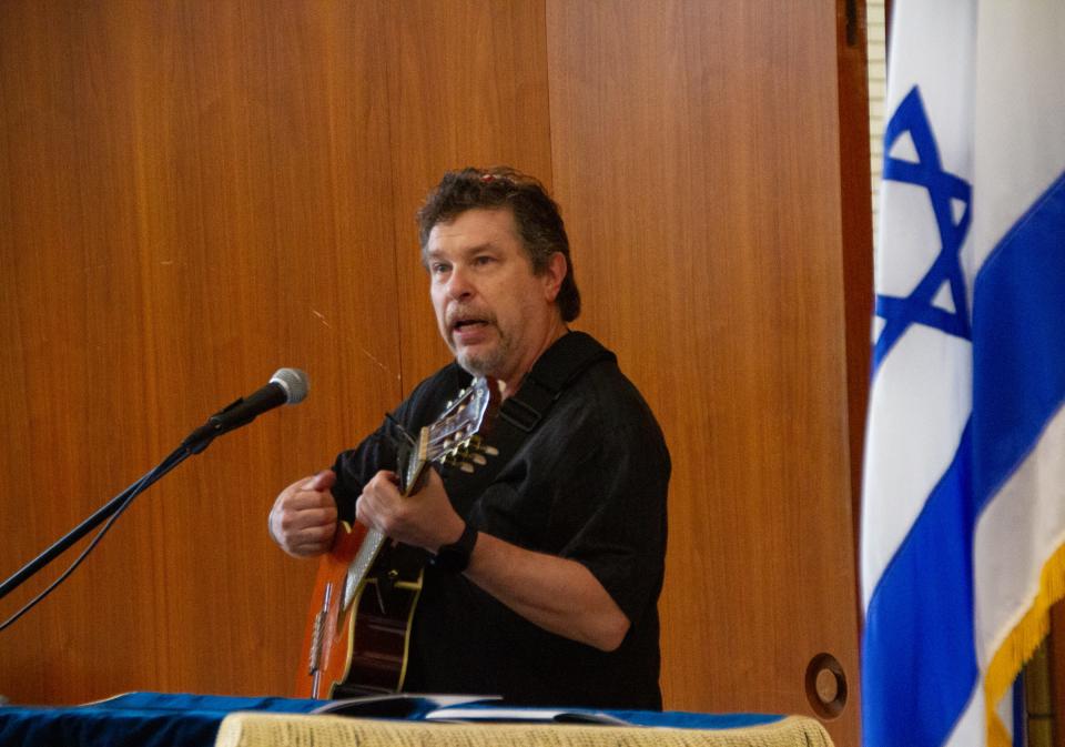 Victor Geigner, a cantor, performs a traditional Hebrew song during the "Stand with Israel" rally Wednesday night at Temple Emanuel in Lakeland.