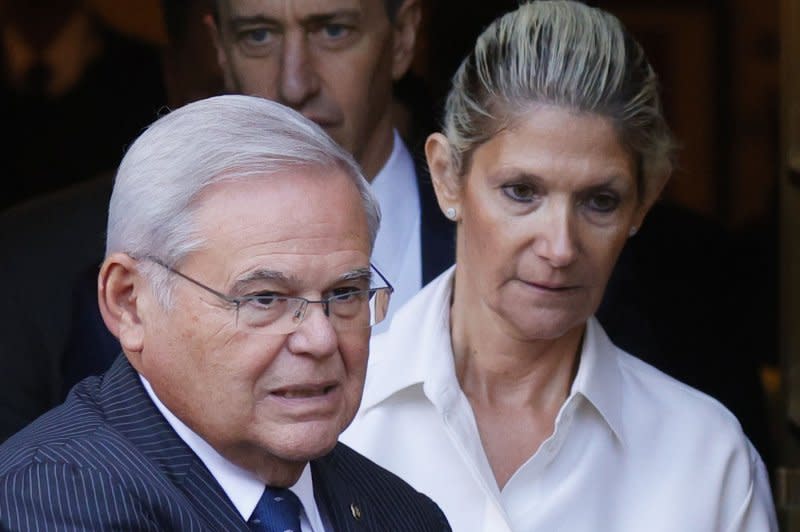 A judge has released a motion to drop charges against New Jersey Democratic Sen. Robert Menendez. He and his wife Nadine (R) are charged along in a plot to accept cash, gold bars, a Mercedes convertible and mortgage payments. in exchange for political favors for the Qatari government. File Photo by John Angelillo/UPI