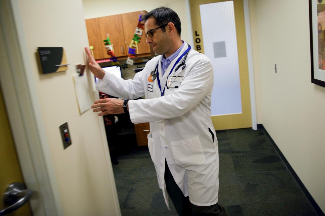 Dr. Mohammad Jaber prepares to visit a patient in Sacramento, Calif., in November 2015.