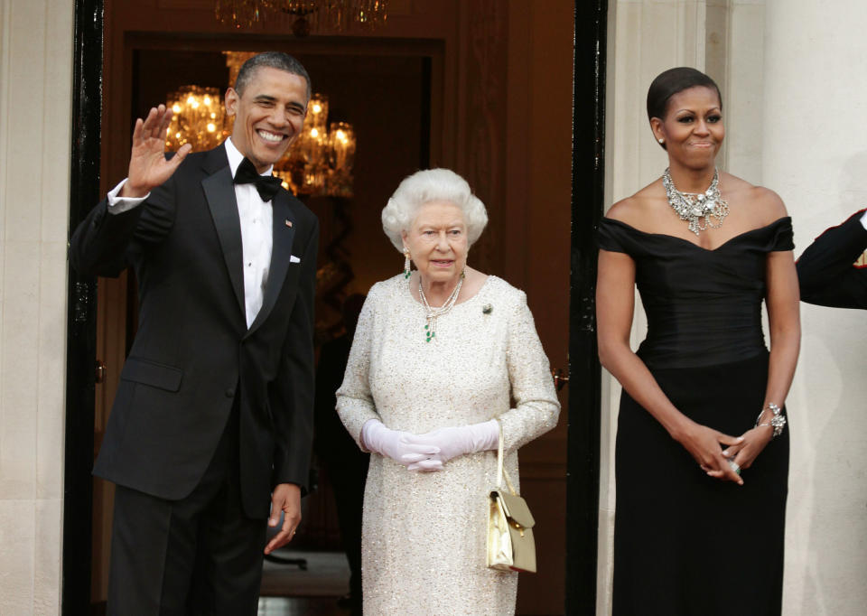 Queen Elizabeth with former U.S President Barack Obama and Mrs. Michelle Obama in 2011. The Queen is wearing a brooch personally gifted by the Obamas. Her Majesty re-wore the brooch earlier this month while President Donald Trump was in London. Image via Getty Images.