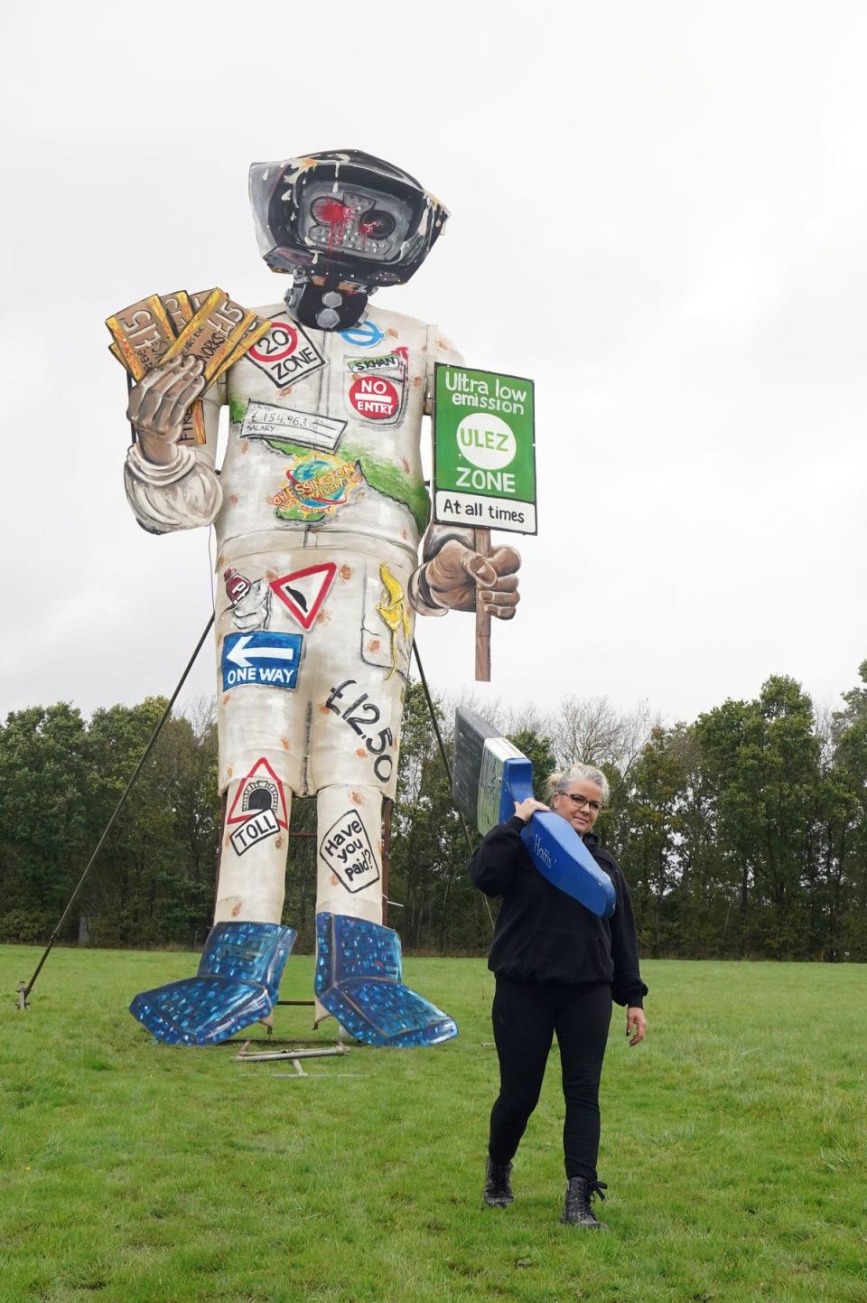 Artist Andrea Deans puts the finishing touches to Edenbridge Bonfire Society's latest celebrity guy, the Mayor of London Sadiq Khan (PA)