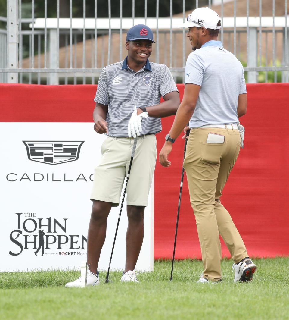 Everett Whiten Jr. and Chase Johnson chat on the fifth tee during the final round of the 2022 John Shippen National Invitational at the Detroit Golf Club on Sunday, July 24, 2022.