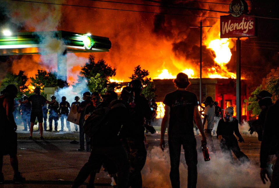 ATLANTA, USA - JUNE 13: Demonstrators set on fire a restaurant during the protest after an Atlanta police officer shot and killed Rayshard Brooks, 27, at a Wendy's fast food restaurant drive-thru Friday night in Atlanta, United States on June 13, 2020. As nationwide protests slowed in the death of George Floyd, anger again erupted Saturday in the US over the fatal shooting of another black man. Mayor Keisha Lance Bottoms announced Atlanta Police Chief Ericka Shields voluntarily stepped down from the department earlier in the day. (Photo by Ben Hendren/Anadolu Agency via Getty Images)